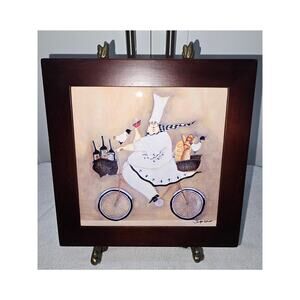 Jennifer Garant “Fat Chef on Bicycle” Framed Ceramic Tile – (2 Feet Missing)